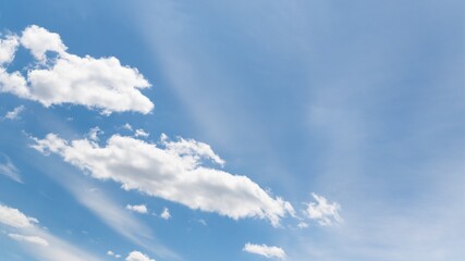 Wall Mural - White cirrocumulus clouds in the blue sky. Beautiful sky background, 16:9 panoramic format