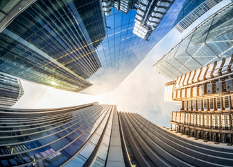 Wall Mural - Looking up perspective of financial buildings. Financial business concept 