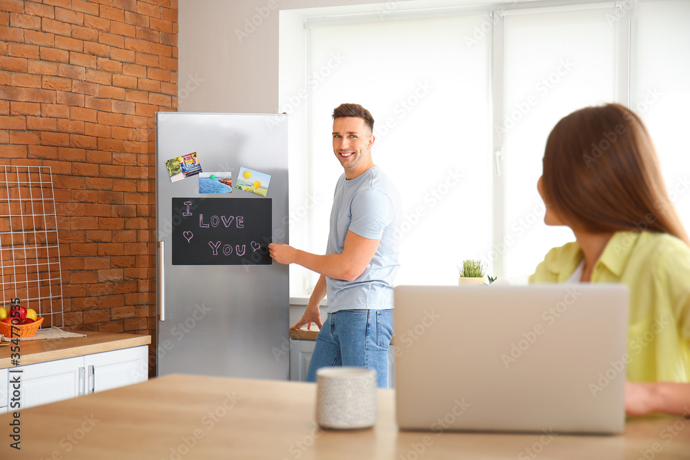 Young couple resting in kitchen