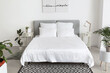 © Pixel-Shot - Big comfortable bed with clean linen in room