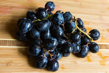 Bunch of freshly washed black grapes