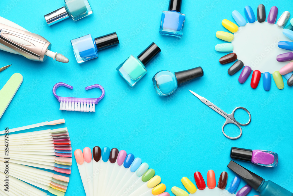 Supplies for manicure on color background