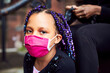 © Granger Wootz - Young Mixed Race Girls Having Their Hair Braided Wearing Masks