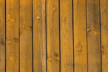 Wall Mural - Texture of a yellow fence made of wooden boards