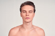 © Svitlana - Portrait of a young sexy naked white guy with closed eyes.