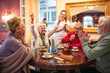 © didesign - Older woman wins in a domino game and celebrates it