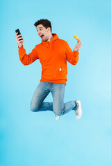 Wall Mural - Portrait of a cheerful young man wearing hoodie