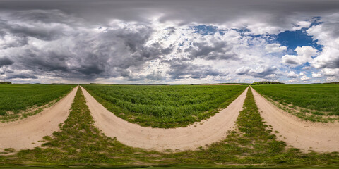 Wall Mural - full seamless spherical hdri panorama 360 degree angle view on no traffic gravel road among fields w