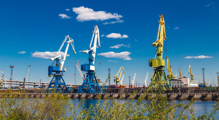 cargo cranes in a river port