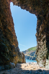 Wall Mural - view of the sea in a cave in sark