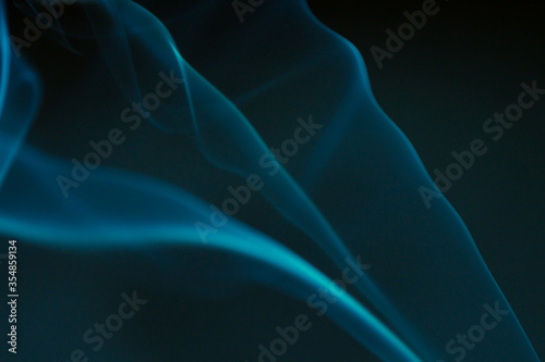 Fotomural Smoke scented candles on a black background