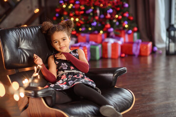 Moscow, Russia 2018 01 December  sadness little girl in christmas day.