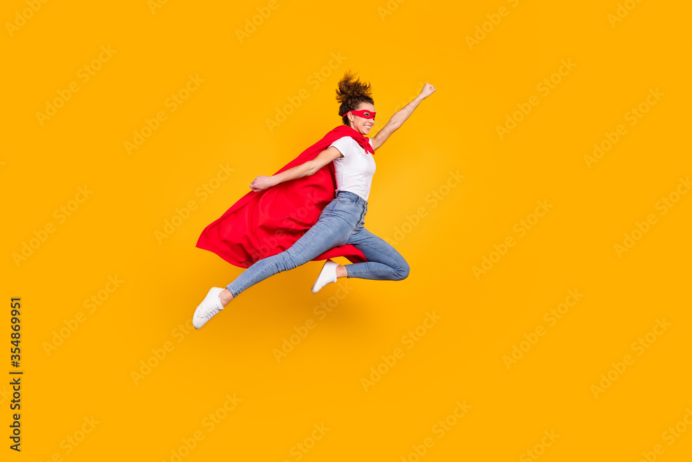 Full length body size view of her she nice attractive strong motivated energetic fit slim cheerful girl jumping wearing cape rescuing earth isolated bright vivid shine vibrant yellow color background - obrazy, fototapety, plakaty 