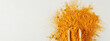 turmeric powder in wood spoon on gray background