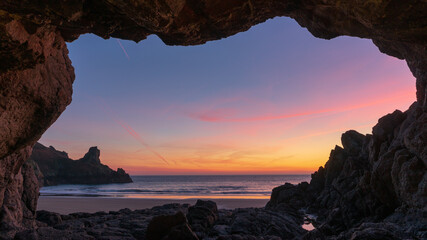 sunset in cave over the sea