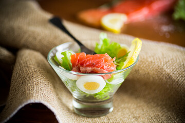 Wall Mural - lettuce salad with salted salmon, boiled eggs