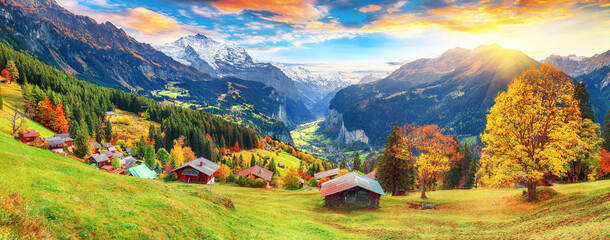 Fabulous autumn view of picturesque alpine Wengen village and Lauterbrunnen Valley