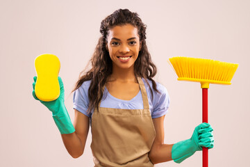 Wall Mural - Portrait of happy and successful african-american professional maid.