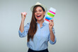 © Yuriy Shevtsov - Happy laughing woman in blue shirt wearing hat holding passport.