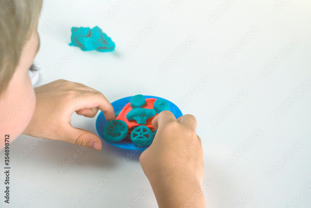 Kids creativity. Plasticine modeling for child development at home. Boy ...