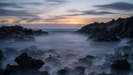 Wall Mural - Moody sunrise over the sea in Guernsey