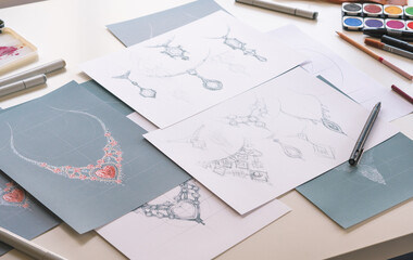 Designer design diamond jewelry drawing sketches making works craft unique handmade luxury necklaces product ideas.