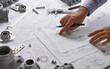 © Chaosamran_Studio - Engineer technician designing drawings mechanical parts engineering Engine.manufacturing factory Industry Industrial work project blueprints measuring bearings caliper tools