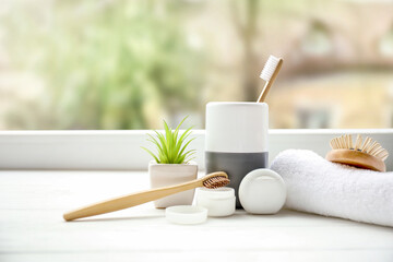 Toiletries near window in bathroom