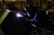 © niwat - Metal workers use manual labor. Skilled welder. Factory workers making OT. Welder is welding the steel in the factory. welder Industrial automotive part in factory.