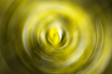 Golden yellow blurred gradient radial motion background. Mixed circular texture