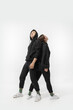 © master1305 - Inclusion. Trendy fashionable couple isolated on white studio background. Stylish woman and man posing in basic minimal stylish clothes equally suitable for both. Concept of equality, inclusive.