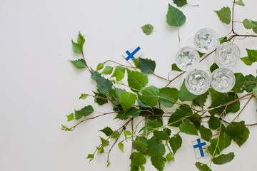 Finnish Juhannus or Midsummer celebration concept photo with flags