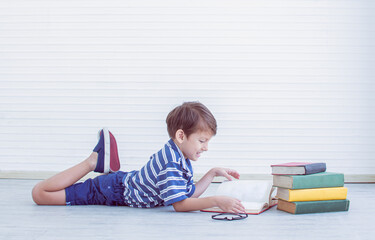 Little boy is reading books.