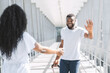 © Prostock-studio - Happy Afro Man Greeting His Girlfriend After Arrival At Airport