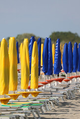 Wall Mural - umbrellas on the beach all closed due to the economic crisis