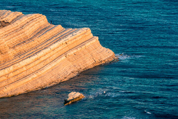 Stair of the turks (scala dei turchi).
Sunset view of the famous rocky coast located in Realmonte near the city of temples in Agrigento.