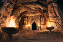 3d Illustration Fantasy Temple Entrance With Skeleton Monk Statues And Torches In Desert Cave.