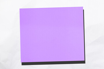 Poster - color sticky sheet on crumpled white paper