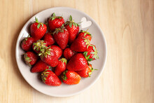 Strawberries In A Plate On A Light Background