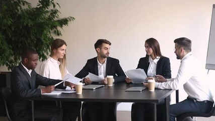 Wall Mural - Different ethnicity partners millennial businesspeople gather at modern boardroom discuss new project analyzing report listens team leader negotiating planning future work, teamwork brainstorm concept