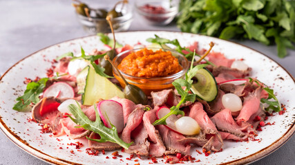 Canvas Print - Veal roast beef slices on a plate. Tasty snack