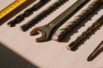 Set of vintage hand construction and carpentry tools hammers on a old wooden background, retro concept