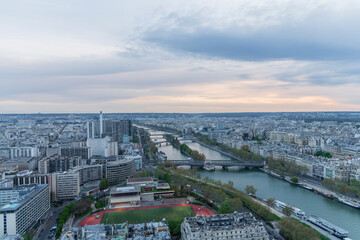 Panorama of Paris in the evening from the height of bird flight at sunset