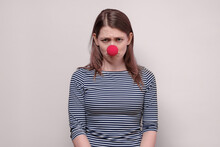 Woman With Red Nose Looking Angry And Frustrated