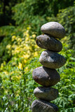 Fototapeta Desenie - Stacked rocks in a garden, meditation focus for wellness
