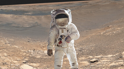 Wall Mural - single space astronaut with black glas on the helmet on the mars surface. elements of this image wer