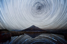 Star Trails Over Mt. Taranaki Reflecting In Pouakai Pool, New Zealand