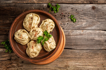 The National Kazakh and Uzbek cuisine. Manti or manty dumplings, popular asian dish. Food recipe background. space for text. top view