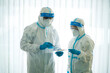 © tuastockphoto - Asian doctor holding checking coronavirus or covid-19 infected patient name list sheet in quarantine area in hospital. Corona virus, Covid 19 virus outbreak, medical mask or virus outbreak concept