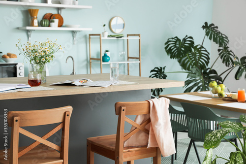 Interior of modern kitchen with stylish table Poster Mural XXL